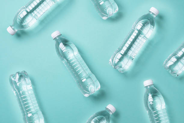 istock Pattern of plastic bottles with water on blue background. Top view. World water day. Copy space. Banner. Pollution, environmental protection concept. Global water crisis. World water problems 1248703663