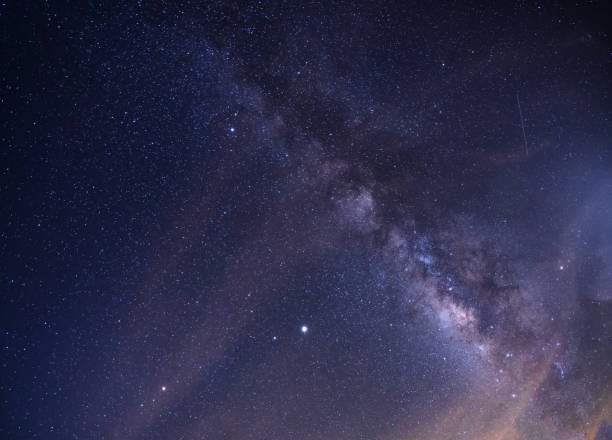 istock Midnight sky with magical light Milky Way or galaxy on a beautiful summer night. 1248705406