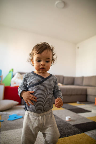 istock Little boy with chocolate on his face at home 1248706868