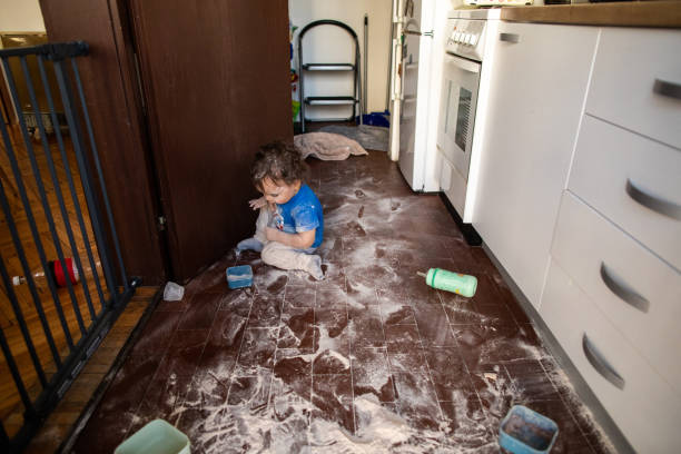 istock Little kid playing with flour at kitchen 1248706938