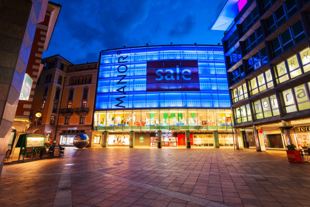 MANOR Lugano shopping mall, Switzerland LUGANO, SWITZERLAND - JULY 09, 2019: MANOR Lugano is a shopping mall a the Piazza Dante square in Lugano city in canton of Ticino, Switzerland lugano stock pictures, royalty-free photos & images