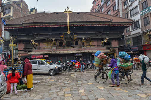 Kathmandu, Nepal - 8 January 2020:  people in front of a traditional house at Kathmandu on Nepal
