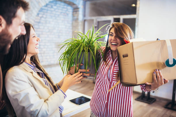 istock Woman having first working day getting in modern office, holding with his personal stuff. 1248713249