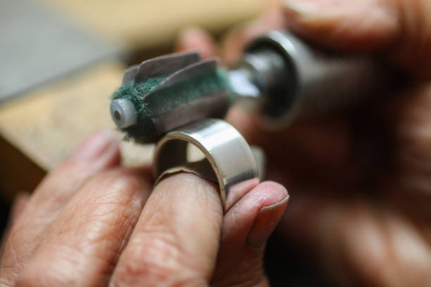 istock A Jeweller is polishing a silver ring. 1248713426