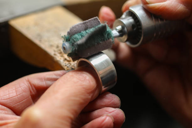 istock A Jeweller is polishing a silver ring. 1248713455
