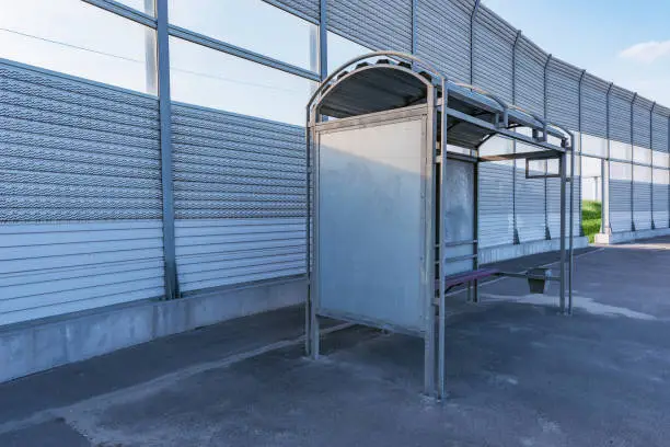 Photo of Empty metal bus stop.