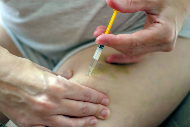 istock Female make insulin self injection in hip. 1248718006