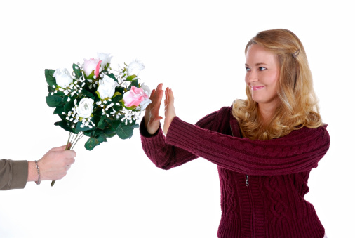 Pretty Woman Receiving Bouquet of Flowers and Politely Rejecting Them.