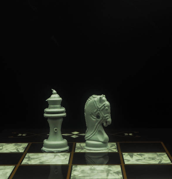 istock Plastic Chess Pieces On Wooden Embroidered Chess Board 1248720106