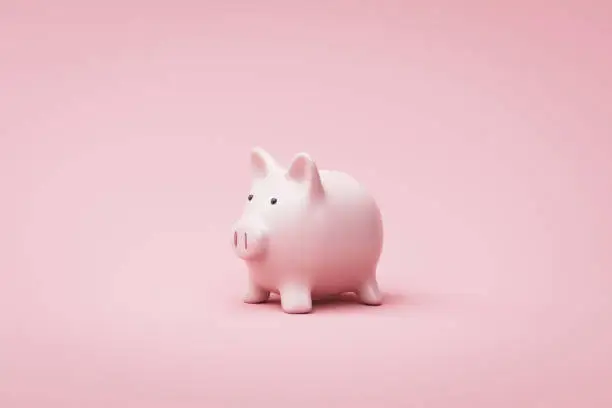 Photo of Piggy bank or money box on pink background with savings money concept. Pink money box and savings idea. 3D rendering.