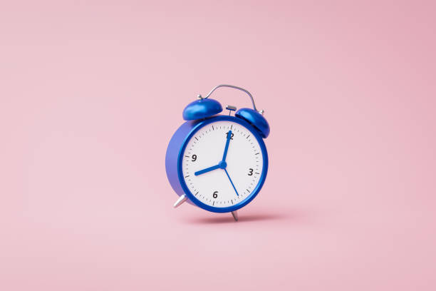 istock Blue alarm clock ringing on pink background with rush hour concept. Notification to wake up time or work. 3D rendering. 1248720919