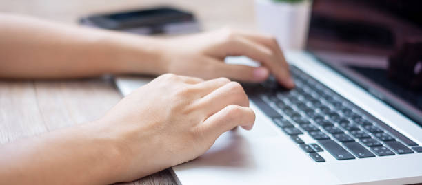 istock Businesswoman using laptop during working at office, Freelancer typing keyboard while making blog at home workplace. technology, Internet and freelance concept 1248721697
