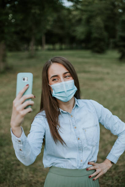 istock Young woman is smiling behind the mask 1248721851