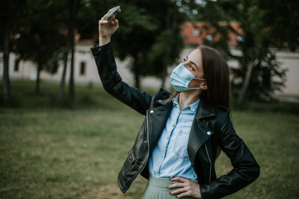 istock Young woman is smiling behind the mask 1248722535