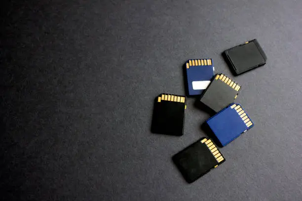 Photo of Group of MicroSD cards over a black background.