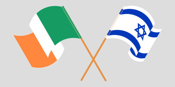 gekreuzte und schwenkende flaggen von irland und israel - irish culture republic of ireland irish flag sport stock-grafiken, -clipart, -cartoons und -symbole