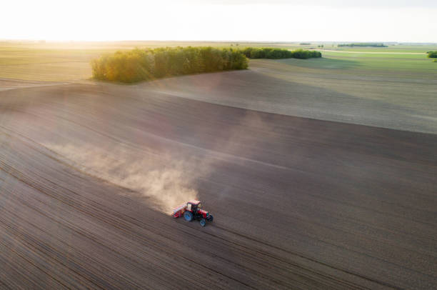 istock Aerial view of tractor working in field 1248726892