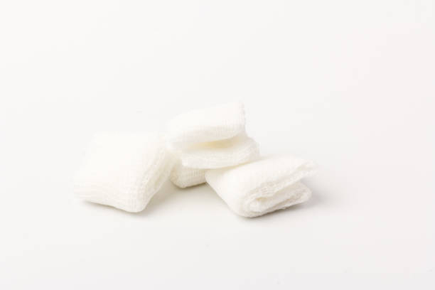 istock White gauze pads on white background. Materials for dental surgery. Close up 1248728191