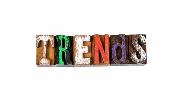 istock TRENDS. Colored wooden letters on a white background 1248728514
