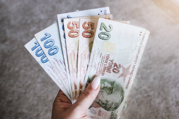 istock Hand holding Hundred, fifty Turkish Lira banknote 1248728871