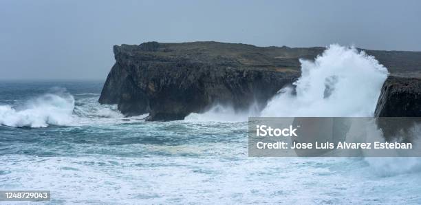 Landscape Of The Karst Limestone Sea Cliffs In Asturias In The Llanes Coast North Of Spain With The Waves Cruhsing Against The Cliffs Stock Photo - Download Image Now