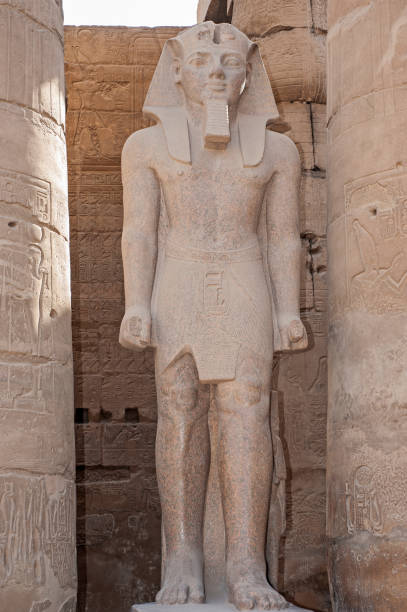 istock Statue and hieroglyphic carvings at an ancient egyptian temple 1248730610