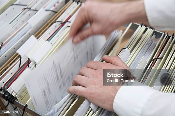 Searching In A File Cabinet Stock Photo - Download Image Now - Document, Searching, File Folder