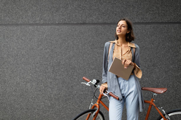 istock Young business woman using a digital tablet computer outdoor city 1248733425