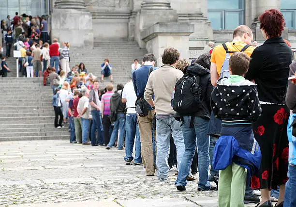 Couples and families queue for admission to Reichstag in Berlin, Germany
