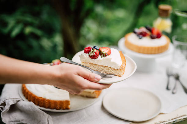 istock Woman serving delicious fruit cake 1248736025