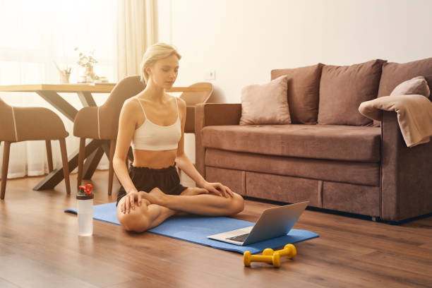 istock Sporty woman working out on a mat 1248737616