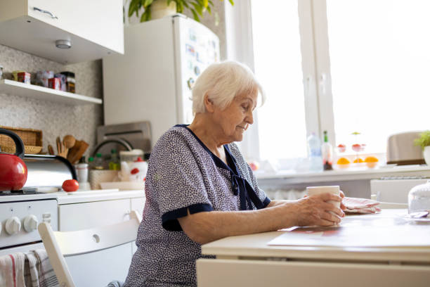 istock Elderly woman looking sad 1248739772