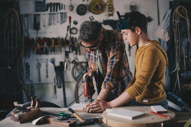 istock Father and son working with wood 1248742032