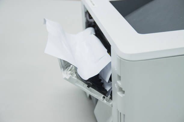 istock Paper A4 Stuck In Printer At Office, concept repair printer 1248742954