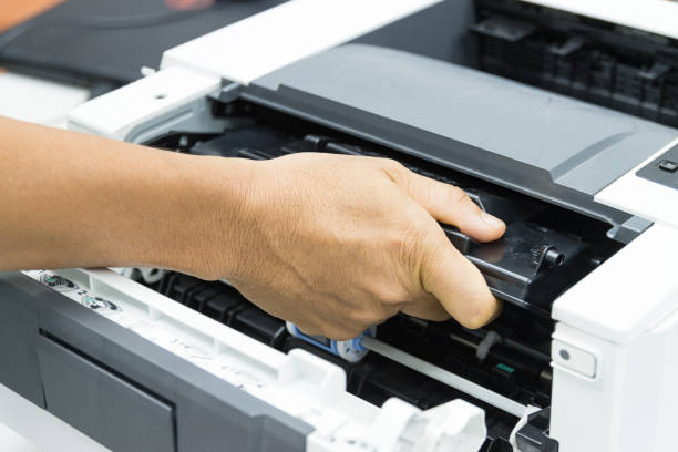 istock Technicians replacing toner in laser printer concept office supplies repair 1248742959