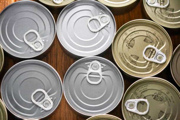 istock various tuna cans arranged in gold and silver color from a top view 1248743215