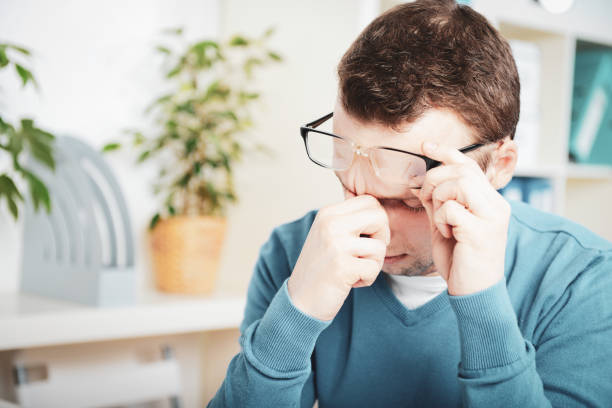 istock young businessman in the workplace,Overworked 1248744710