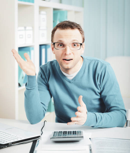 istock young businessman in the workplace,Overworked 1248744907