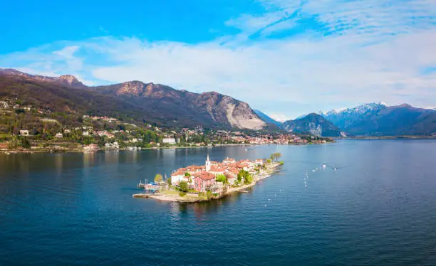 Isola dei Pescatori and Stresa town aerial panoramic view. Isola dei Pescatori or Fishermens island is an island in Lake Maggiore in northern Italy.