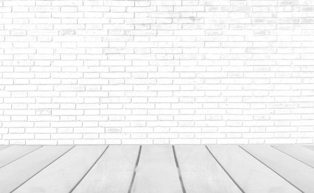 istock Empty room with grey wooden floor with brick wall background 1248746054