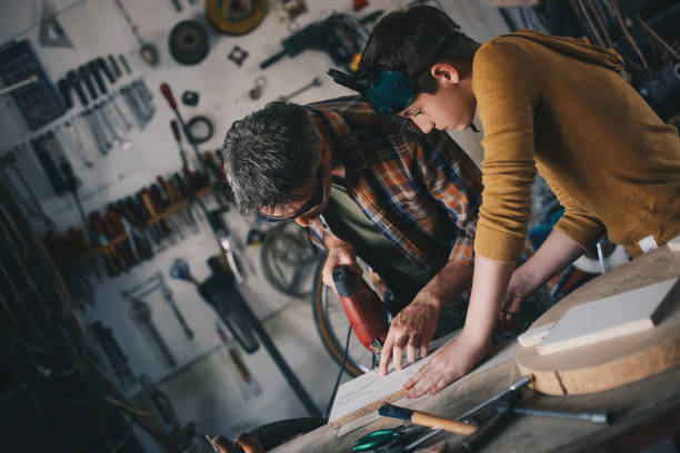 istock Father and son working with wood 1248746405