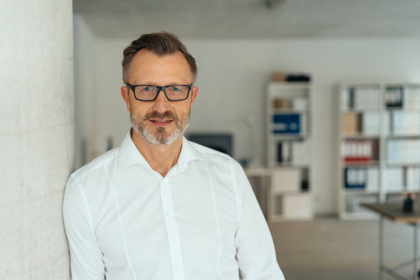 istock Thoughtful calm businessman staring at the camera 1248746608