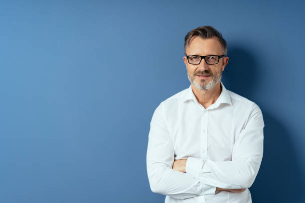 Middle-age man in glasses with arms folded