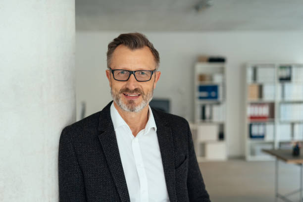 istock Attractive middle-aged businessman in the office 1248747781