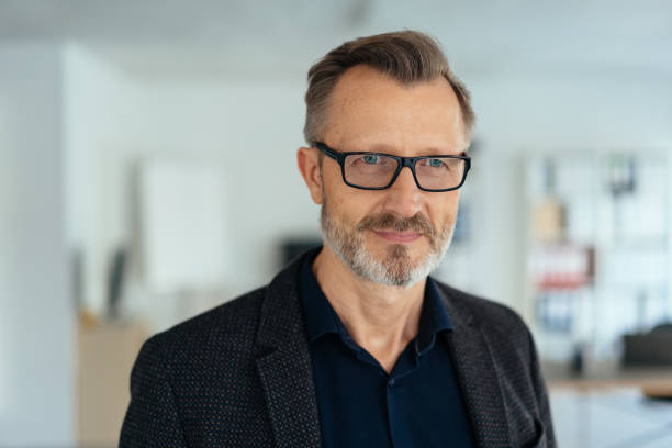 istock Middle-aged businessman staring off to the side 1248748135