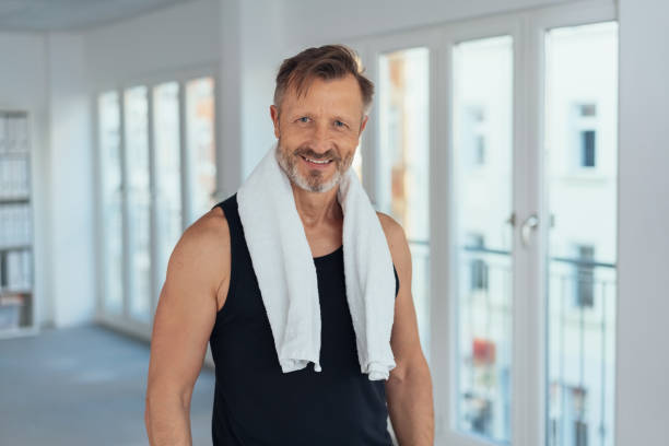 istock Fit athletic man after a workout in a gym 1248748405