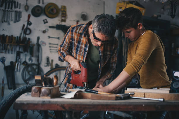 istock Father and son working with wood 1248748529