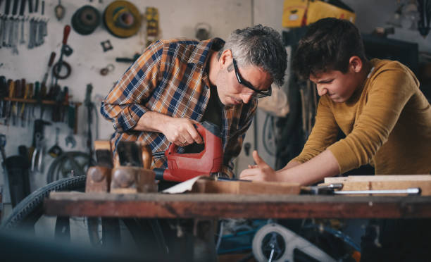 istock Father and son working with wood 1248748533