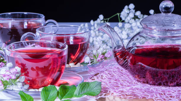istock Teapot with red tea.Medicinal therapy on medicinal herbs and decoctions.Spicy herbs and medicinal broths.Relaxing and tonic drink.Zen tea ceremony. Hot luxury tea with a pleasant smell in a cozy home 1248748928