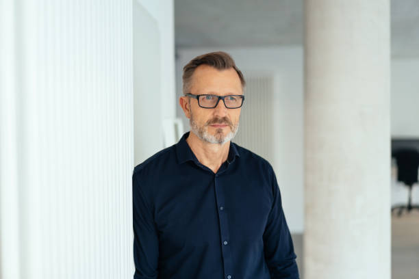 istock Worried businessman staring intently ahead 1248749594